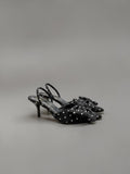 Day One Concept Store black slingback heels with white polka dots and a large bow detail on the toe.