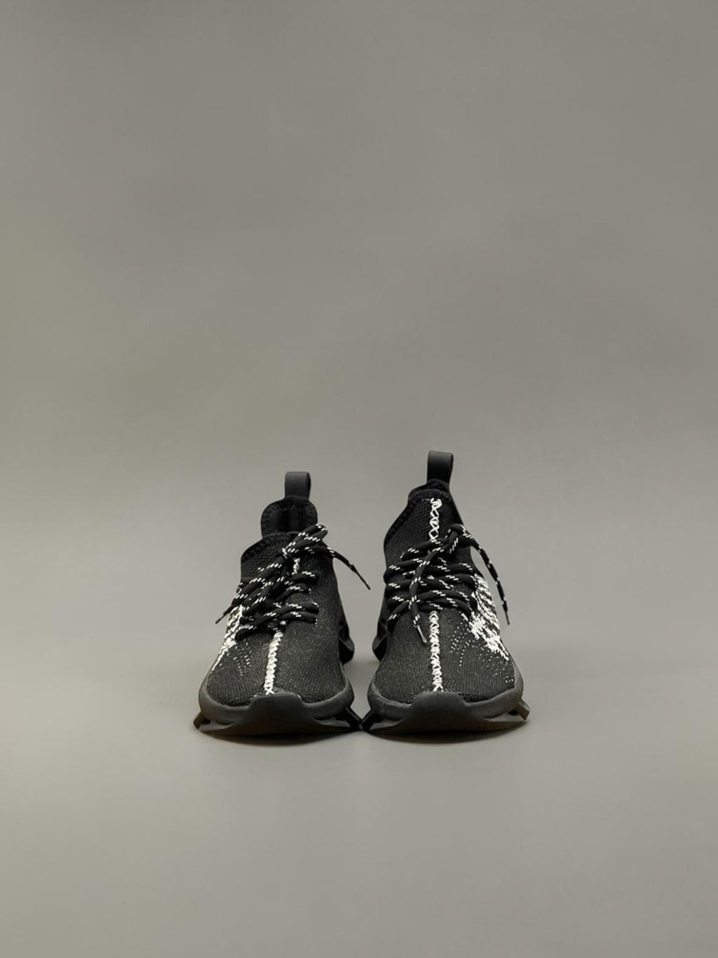 Day One Concept Store black and white knit chunky sole sneakers with graphic detail and pull tab.