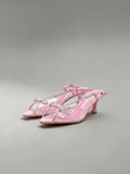 Day One Concept Store pink slingback sandals with clear straps, bow details, and rhinestone embellishments. Pointed toe with a stiletto heel.