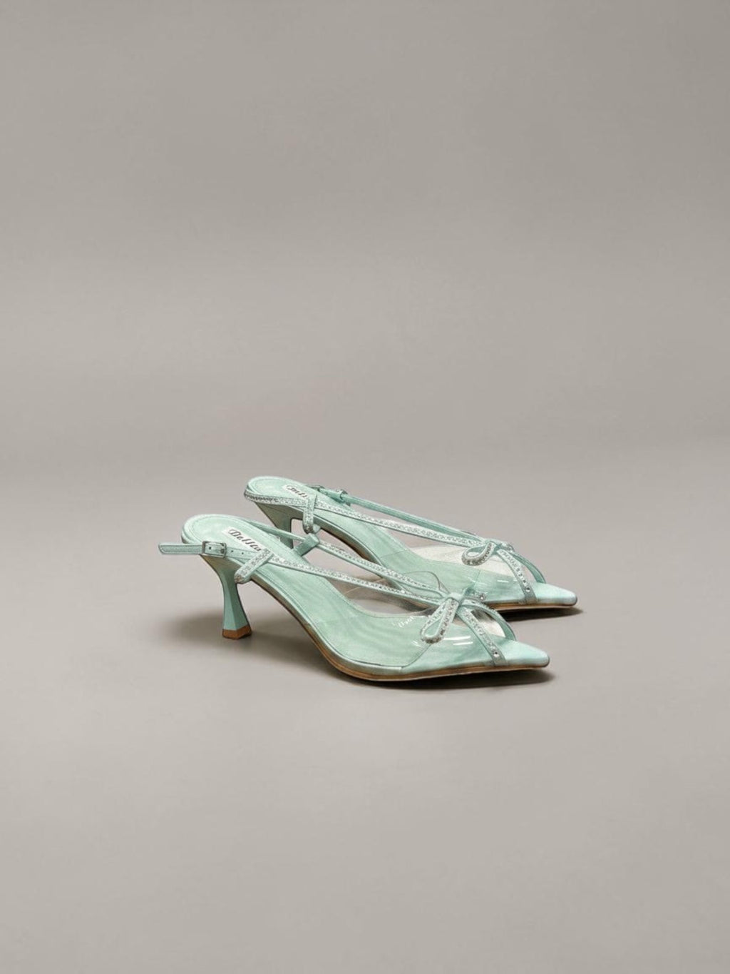 Day One Concept Store aquamarine slingback sandals with crystal embellishments and clear PVC straps, featuring a kitten heel.