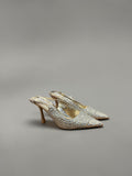 Day One Concept Store beige slingback heels adorned with rhinestones, featuring a pointed toe and stiletto heel.