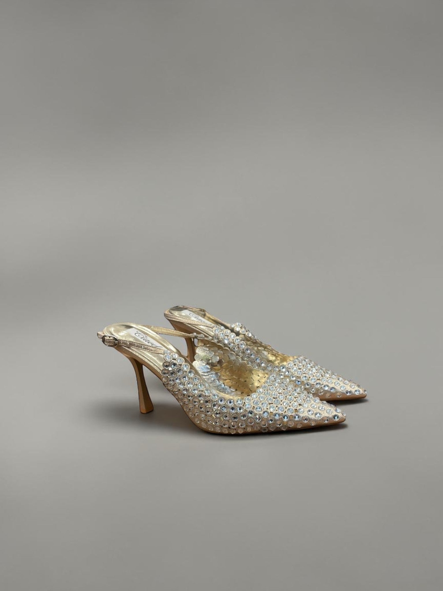 Day One Concept Store beige slingback heels adorned with rhinestones, featuring a pointed toe and stiletto heel.