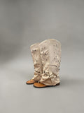 Day One Concept Store beige suede slouchy tall boots with cut-out details and buckle strap.