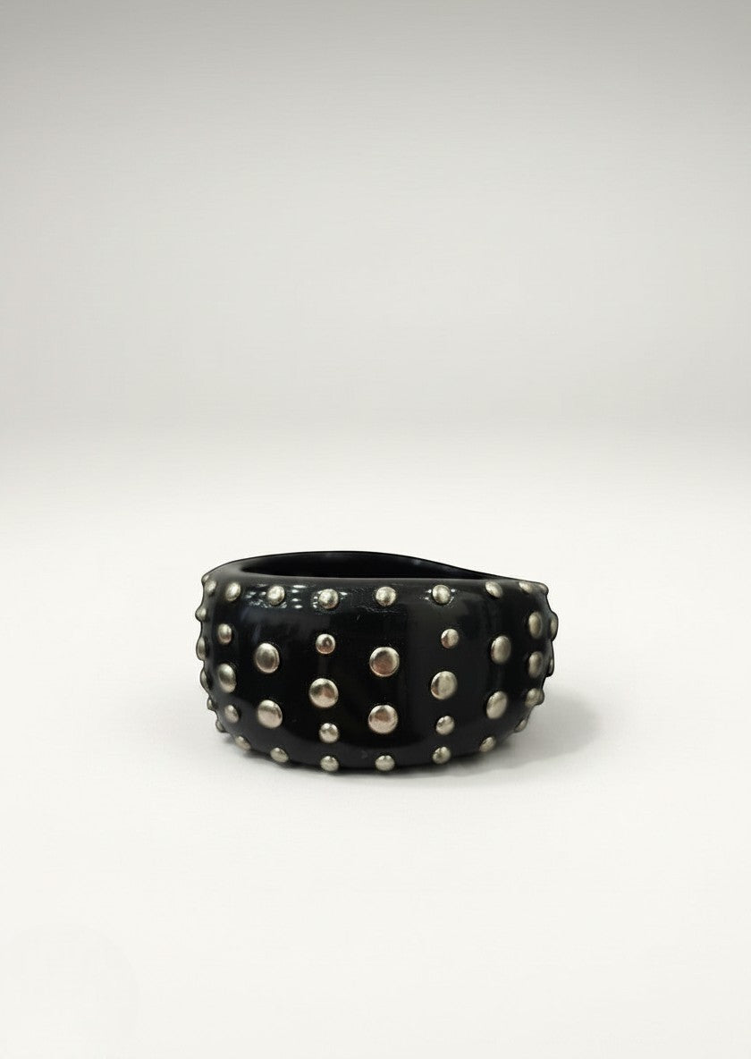 Day One Concept Store black studded rigid bracelet with silver-tone metal studs. Wide cuff design.