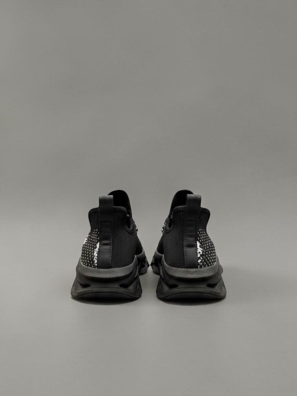 Day One Concept Store black and white knit sneakers with chunky sole and graphic detail.