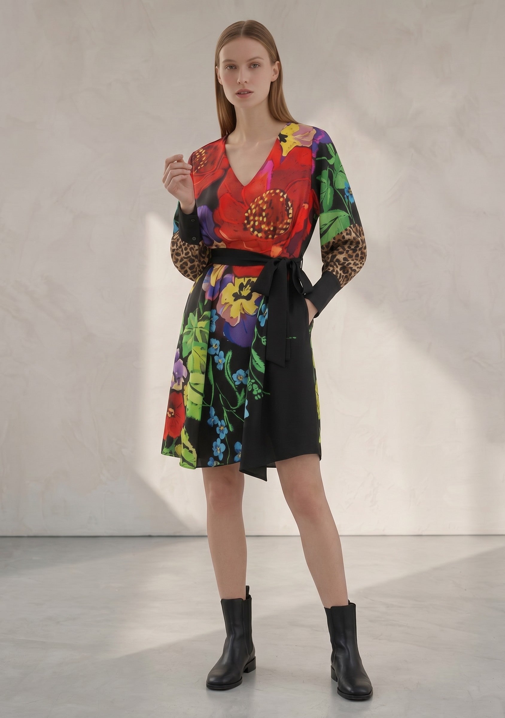 Day One Concept Store women's wrap dress with vibrant floral print, leopard print sleeves, V-neck, and tie belt.