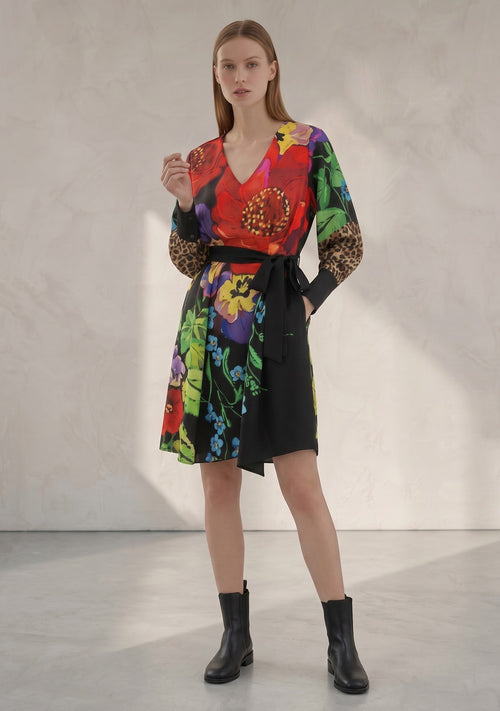Day One Concept Store women's wrap dress with vibrant floral print, leopard print sleeves, V-neck, and tie belt.