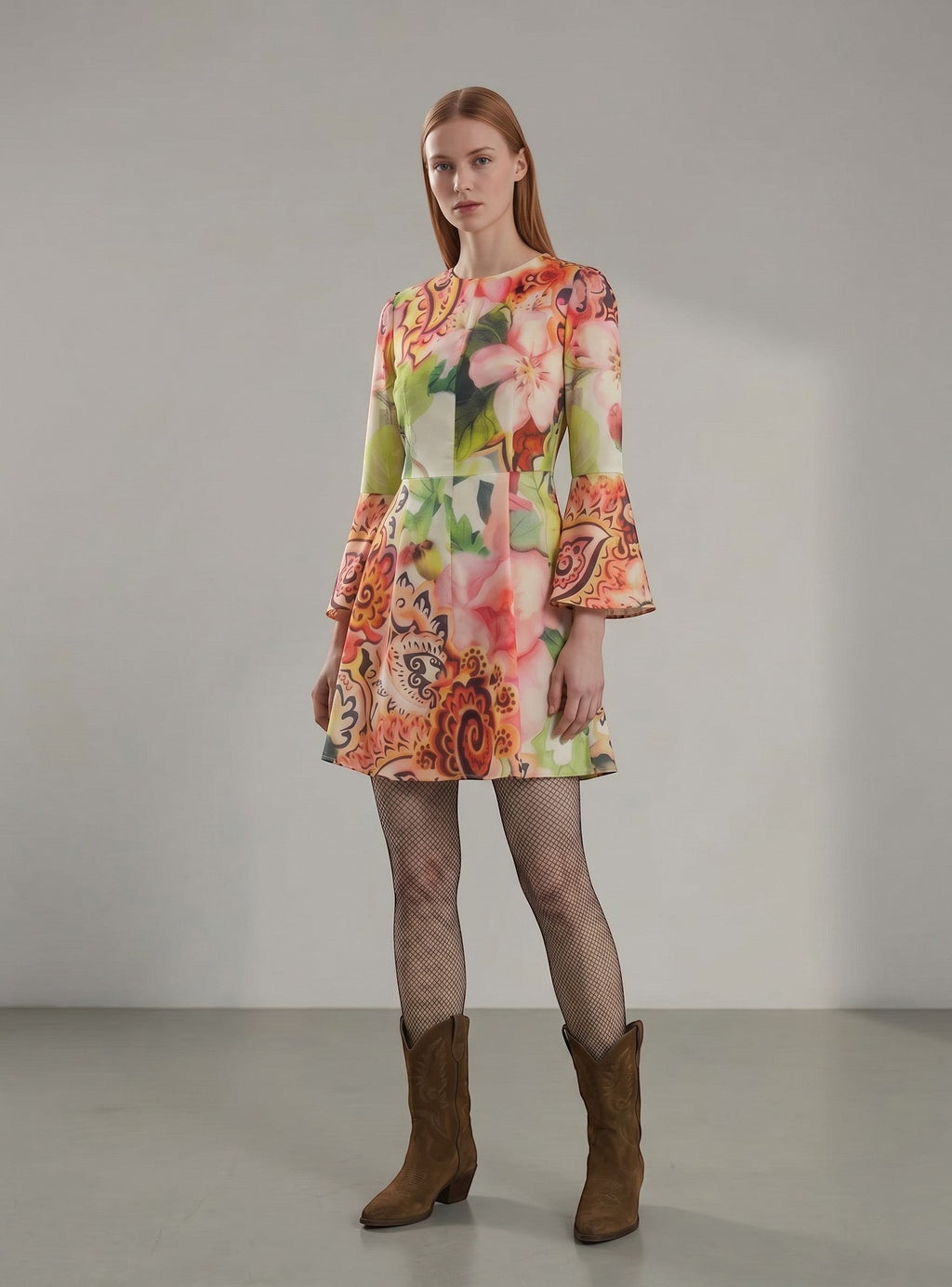 Day One Concept Store mini dress with vibrant floral and paisley print, featuring bell sleeves and an A-line silhouette.
