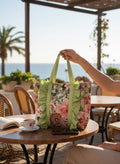 Day One Concept Store floral shopper bag with green handles and ruffled trim, perfect for summer.