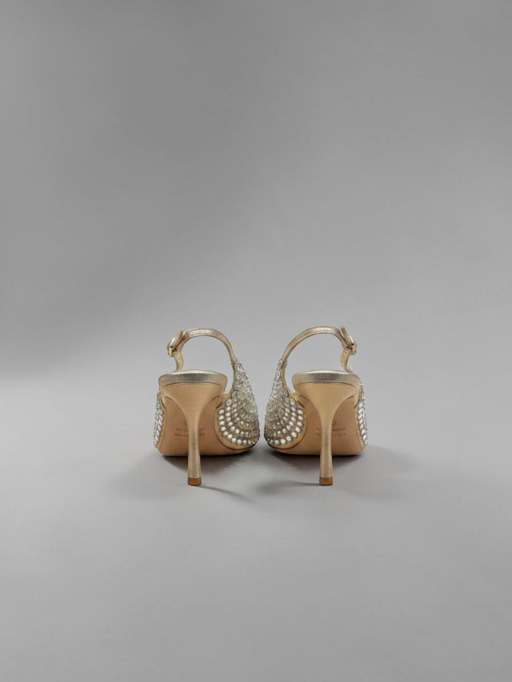 Day One Concept Store gold slingback heels adorned with rhinestones and pearls, featuring a pointed toe and stiletto heel.