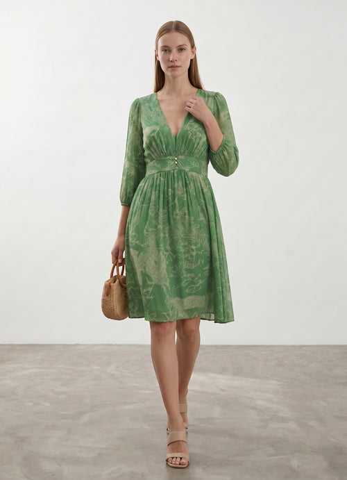 Day One Concept Store green midi dress with V-neck, button detail, cinched waist, voluminous sleeves, and playful all-over print.