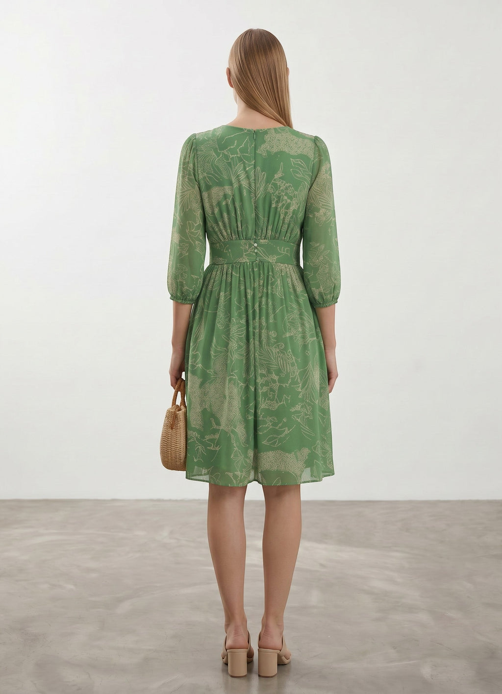 Day One Concept Store green midi dress with all-over print, V-neck, button details, and voluminous sleeves.