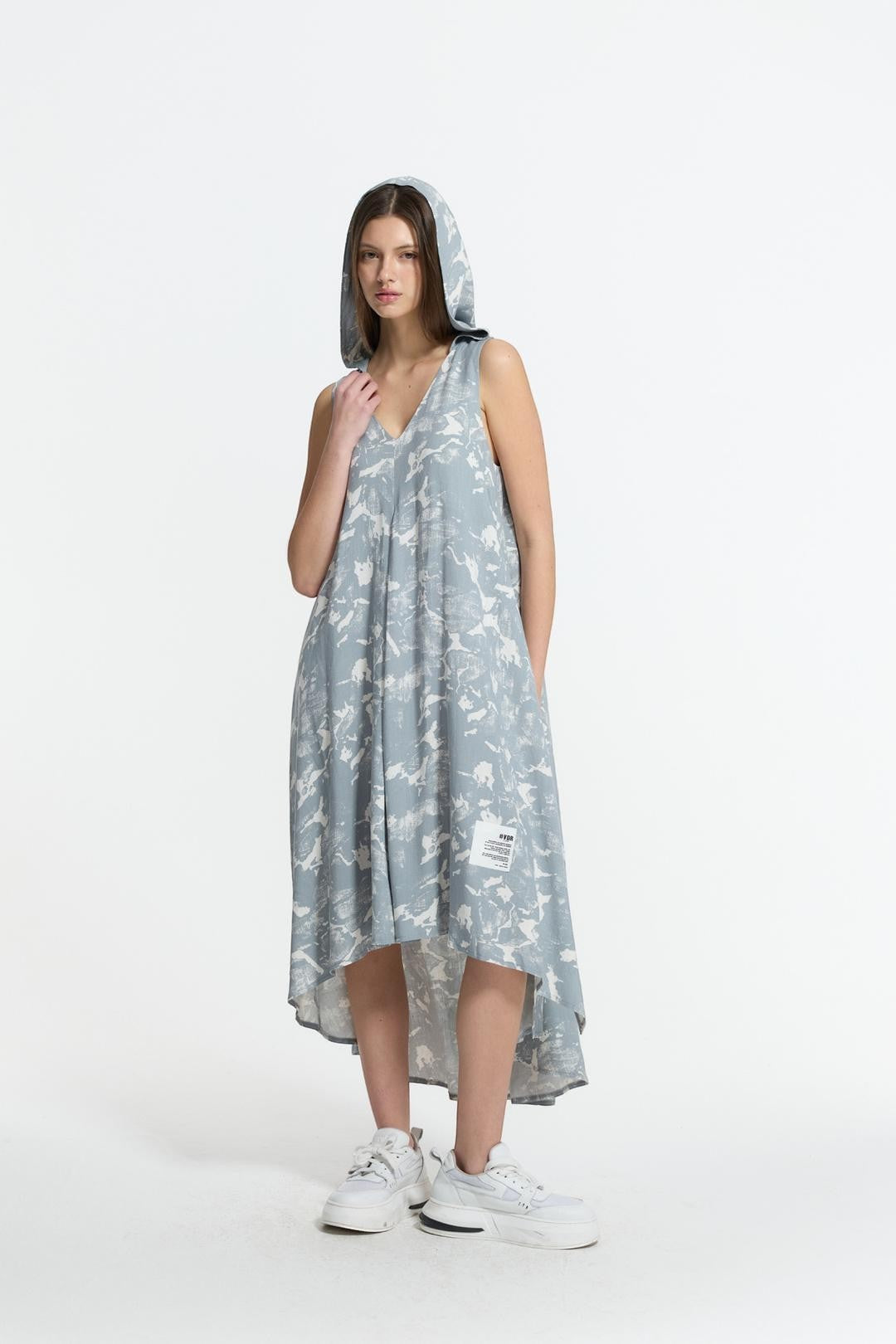 Day One Concept Store light blue floral print hooded maxi dress with V-neck and side slits, worn by a model with white sneakers.