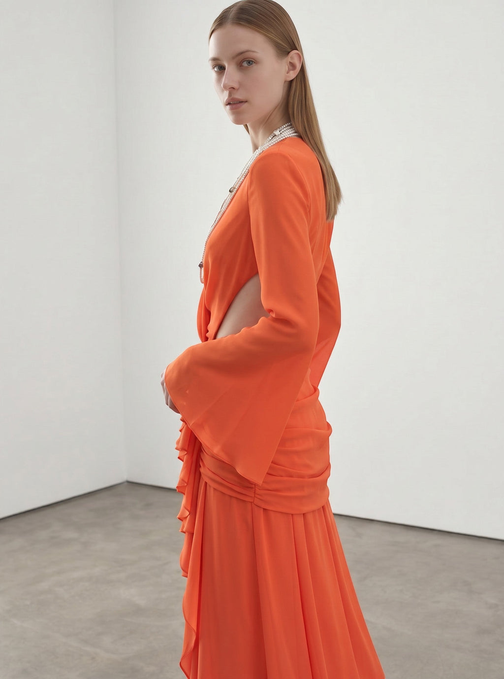 Day One Concept Store orange chiffon maxi dress with deep V-neck, bell sleeves, and ruched waist detail.