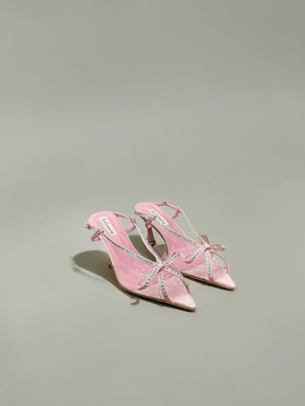 Day One Concept Store pink satin slingback sandals with bow and rhinestone details, pointed toe, and stiletto heel.