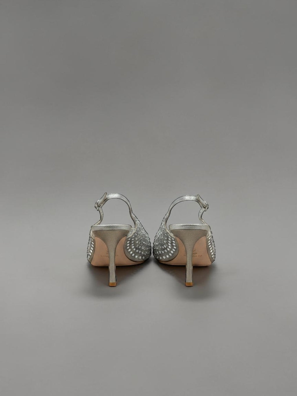 Day One Concept Store silver slingback heels with intricate crystal embellishments and a thin stiletto heel.