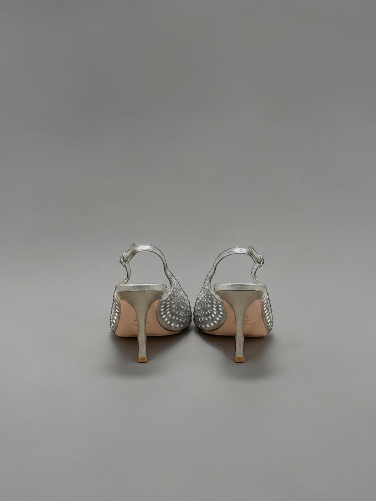 Day One Concept Store silver slingback heels with intricate crystal embellishments and a thin stiletto heel.