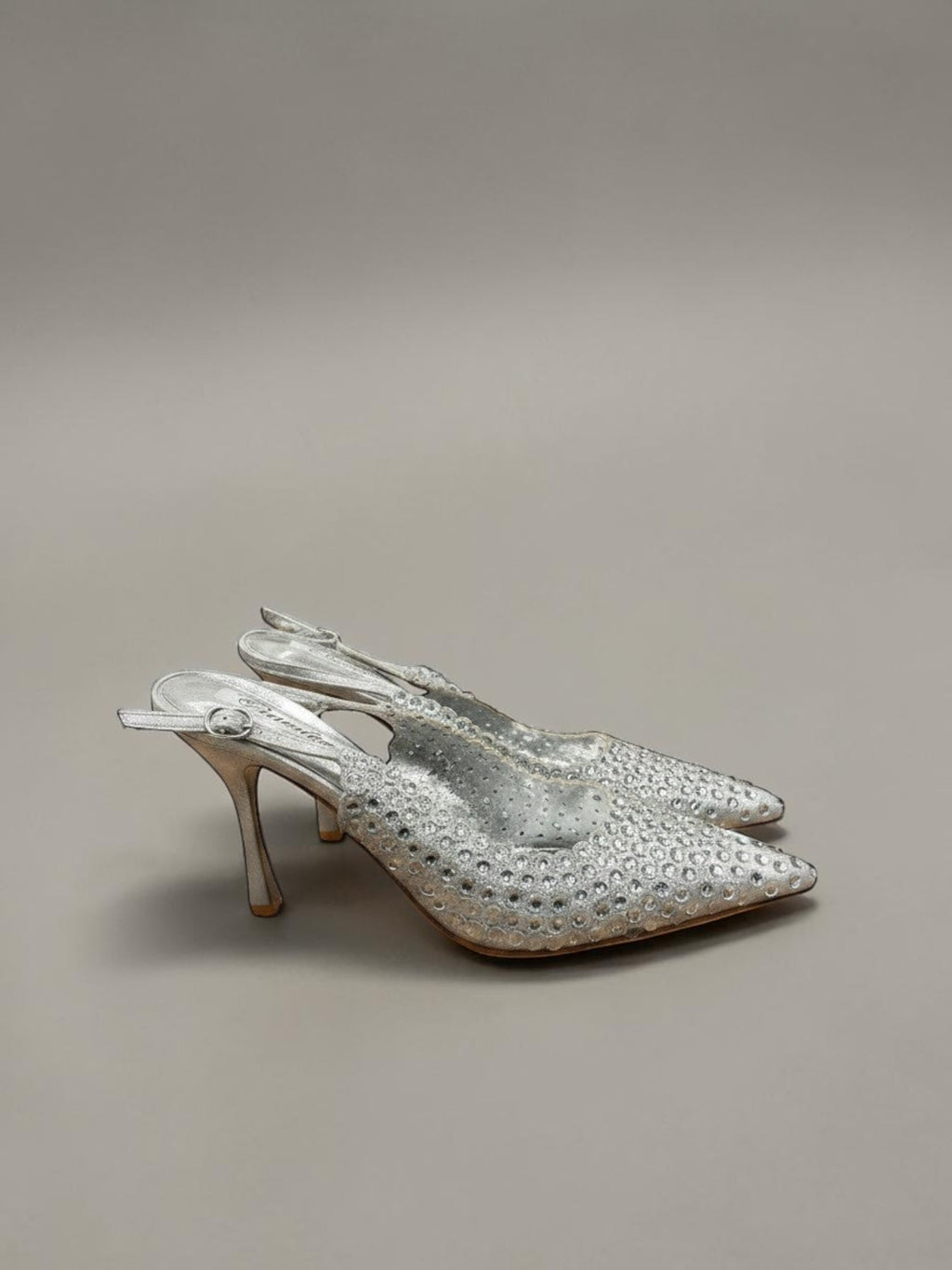 Day One Concept Store silver slingback heels with pointed toe, stiletto heel, and intricate crystal embellishments.