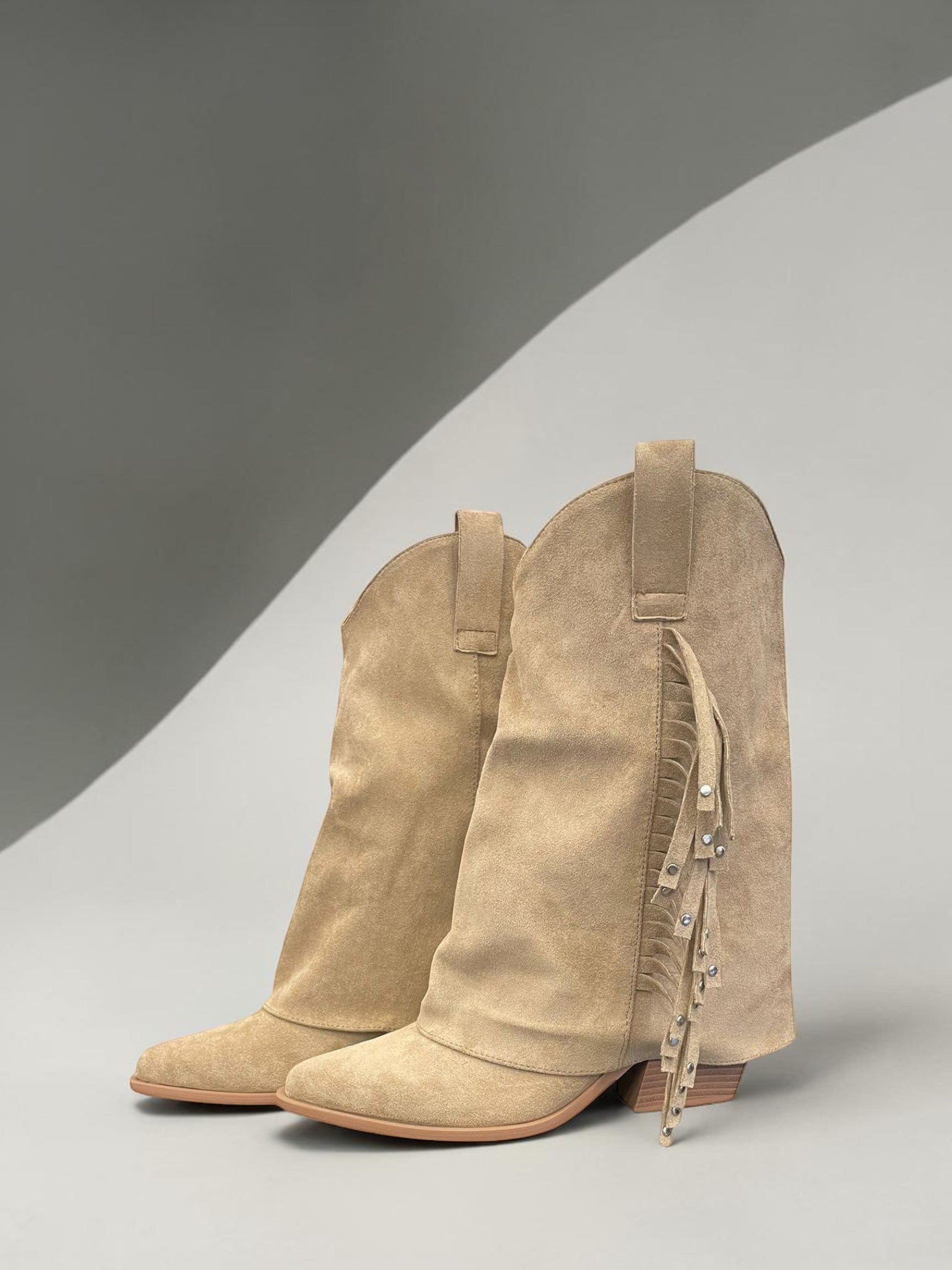 Day One Concept Store tan suede cowboy boots with fringe and stud detailing, pointed toe, and slouchy shaft.