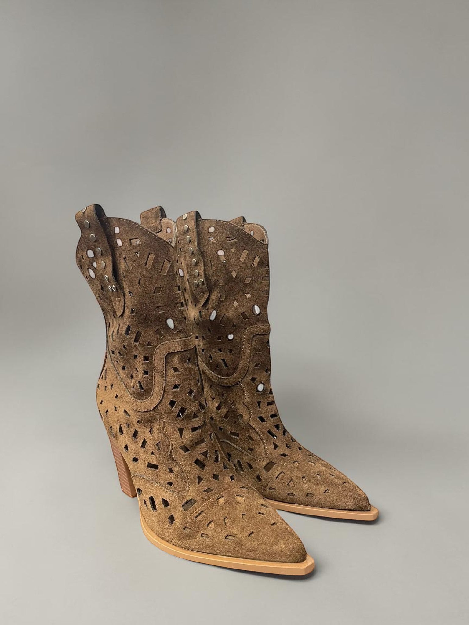 Day One Concept Store tan suede western boots with laser-cut geometric patterns, pointed toe, and stacked block heel.
