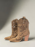 Day One Concept Store tan suede western boots with laser-cut geometric patterns, pointed toe, stacked block heel, and stud embellishments.
